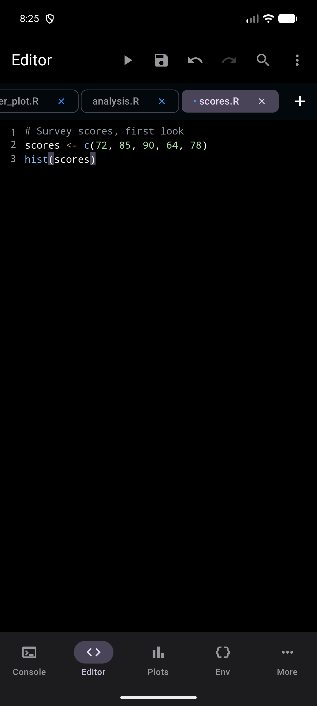 The same script after the rename, its tab now called scores.R and still marked with a dot for unsaved changes, in dark mode