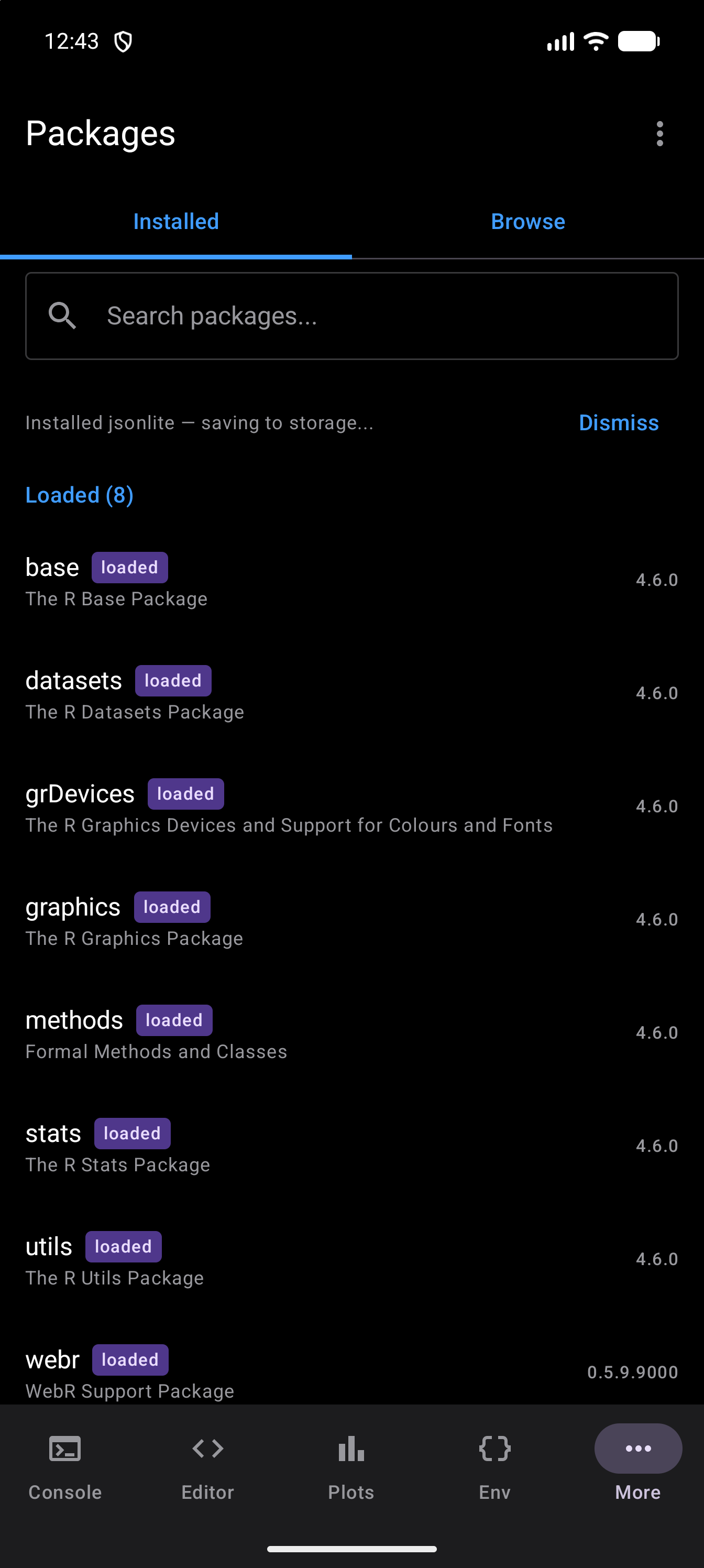 Installed tab once the install has finished, with the message under the search bar saying jsonlite is installed and being saved to storage, and a Dismiss button, in dark mode